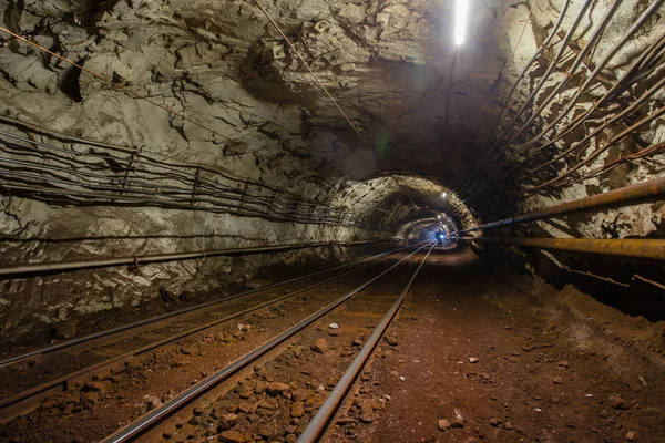Underground gold iron ore mine shaft tunnel gallery passage with light