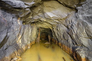 Underground gold mine shaft tunnel drift flooded with water