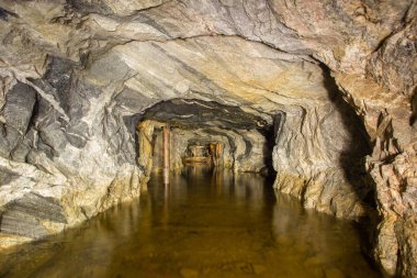 Underground gold mine shaft tunnel drift flooded with water