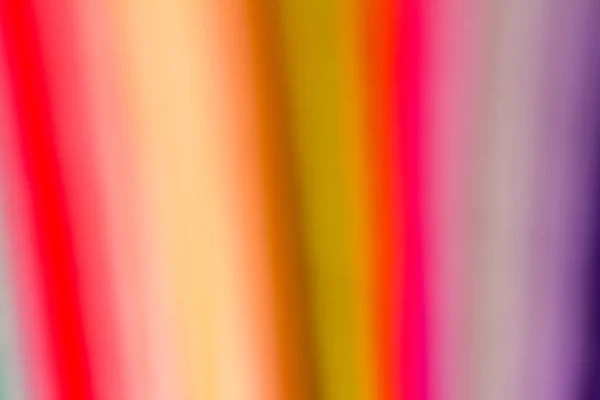 blurred vertical bright color stripes stack of felt sheets selective focus background