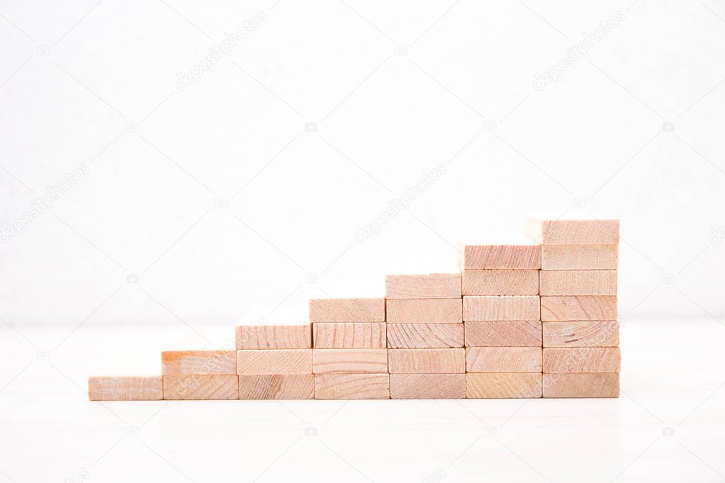 wooden domino stairs side view on white background