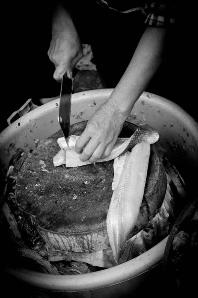 Fresh Fish Chef,cut fish fillet in a fish shop, chef cutting red fish in the kitchen