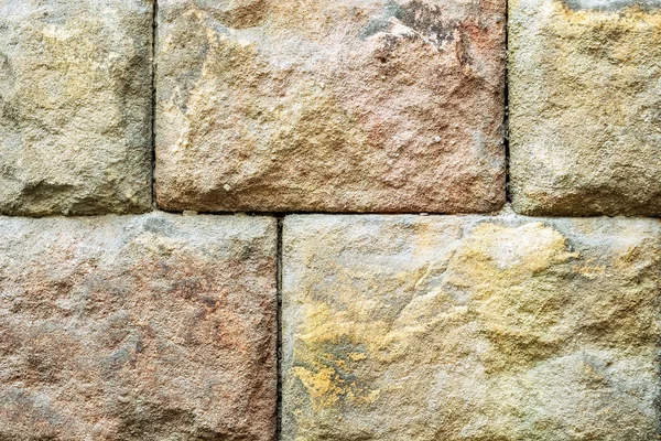 背景として使用するため多彩な石のブロックの壁 — ストック写真