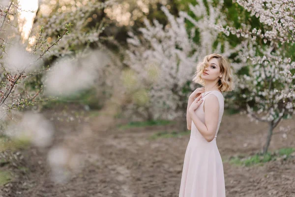 The fair-haired girl in a pink dress — Stock Photo, Image