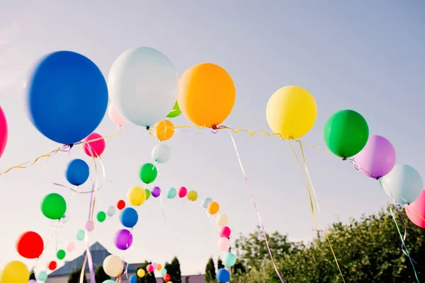 Round balloons of different colours in the sky — Stock Photo, Image