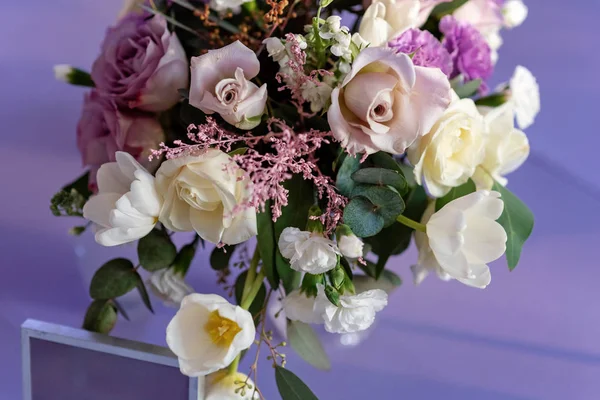 The range of beautiful flowers on a lilac background