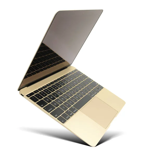 Zwevende gouden laptop in populair ontwerp — Stockfoto