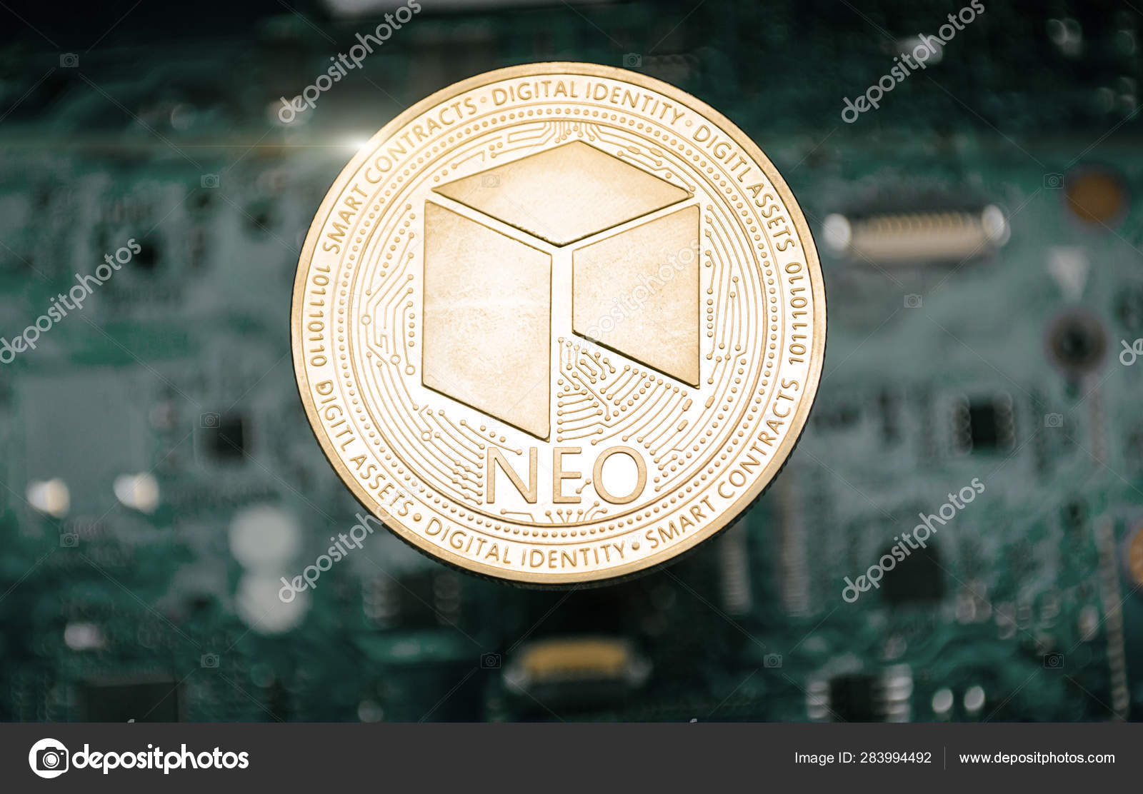 Gold neo coin, on background of computer motherboard. — Stock Photo ©  velishchuk1 #283994492