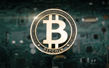 Bitcoin sikke, bilgisayar anakart arka planda. 