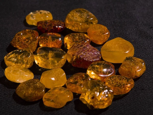 amber products,amber on the light background,manual work, handicraft, handwork, hand work, handmade, handcraft