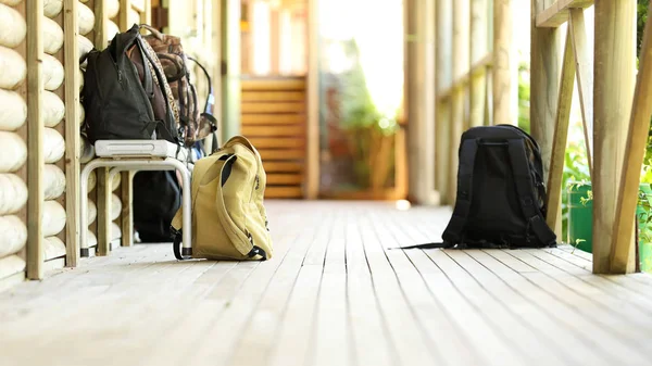 isolated student school bags back packs duffle bags outside a high school classroom. school bags on a seat. educational facility, education environment. learning, lessons, teacher teaching and pedagogy.