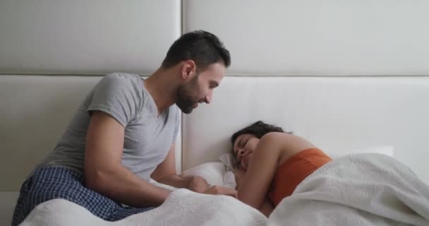 Man Trying Sexual Approach With Woman In Bed At Home — Stock Video