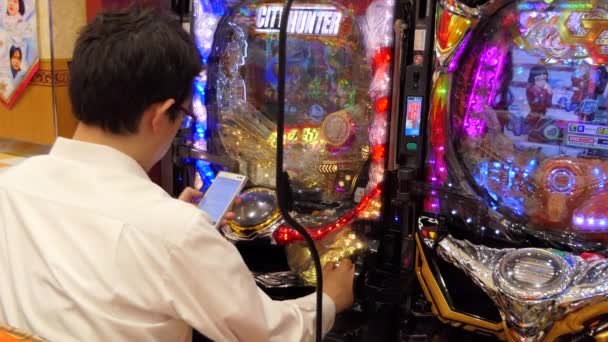 Tokyo Japan July 2019 Japanese Man Smartphone Playing Pachinko Lottery — Stock Video