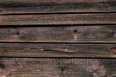 Kaba saba arka plan. Eski bir ahşap doku. Sert ahşap duvar yüzeyi. Grunge masa dekorasyonu. Kirli, yıpranmış ahşap malzeme. Yaşlanmış ahşap çit tasarımı