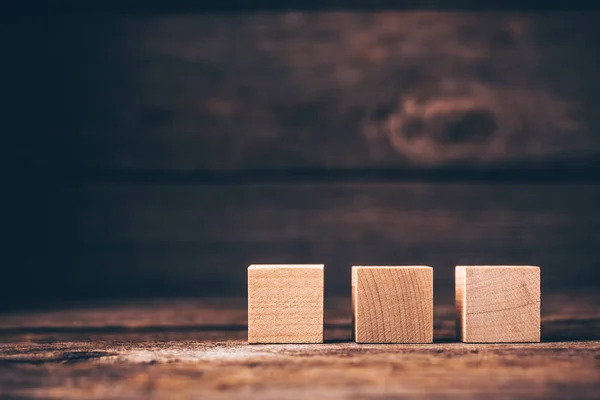 Three Wooden Cubes Wood Background Copyspace — kuvapankkivalokuva