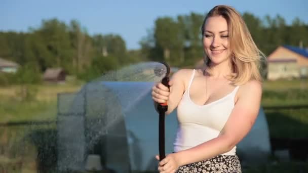 Happy girl watering with watering can — Stock Video