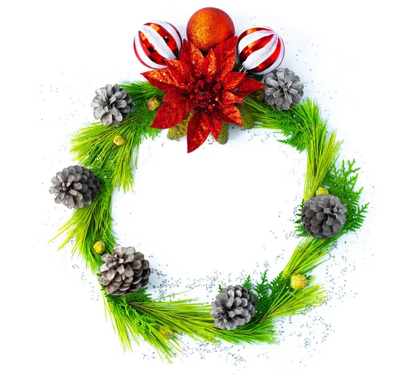 Christmas wreath with red flower and pine trees on the white background. — Stock Photo, Image
