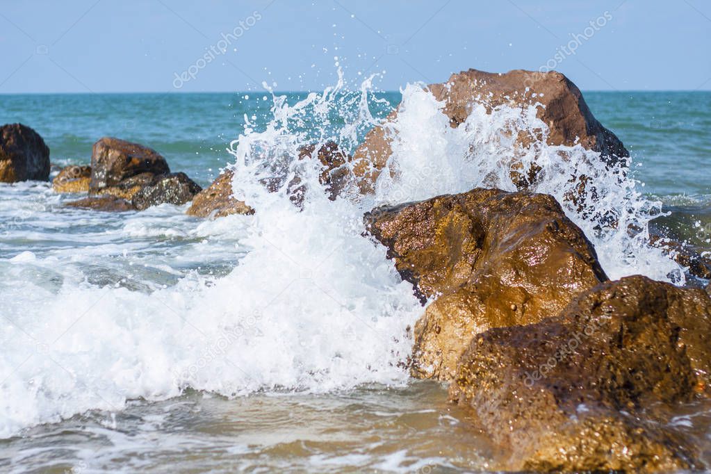 waves beach wind stones