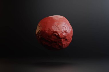 Studio siyah bir zemin üzerine kırmızı top levitating