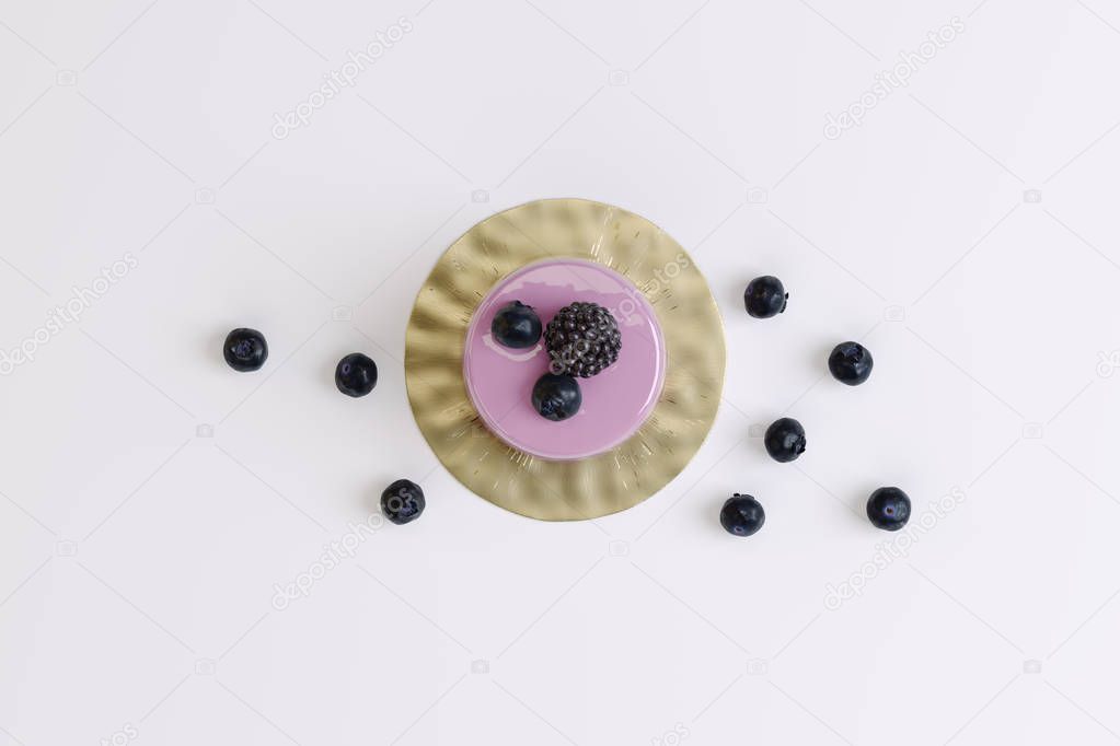 berry muffin with blackberries on a white background