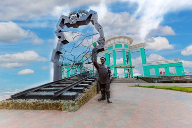 Russia is a huge country and one of the main modes of transportation is the railway. The monument to the railway worker was installed at the railway station of the Siberian city of Omsk clipart