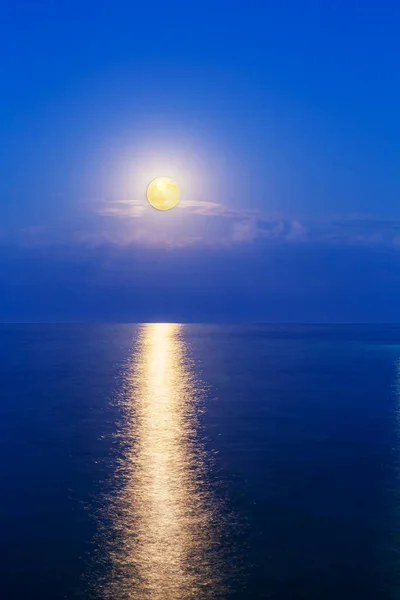 a bright moon has drawn a path on the surface of the black sea along which it seems it is going to roll down to earth.