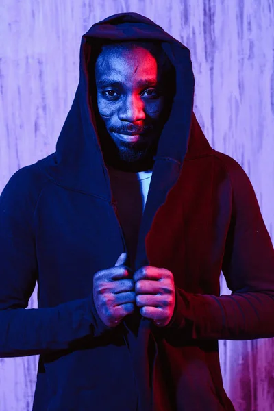 African American Male Black Hoodie Colorful Neon Illumination Looking Camera — Stock Photo, Image