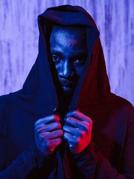 African American Male Covering Face Hoodie Hands Neon Illumination Looking — Stock Photo, Image