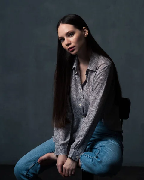 Woman with long beautiful hair looking at camera — Stock Photo, Image