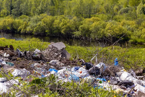 Garbage dump on the picturesque riverbank