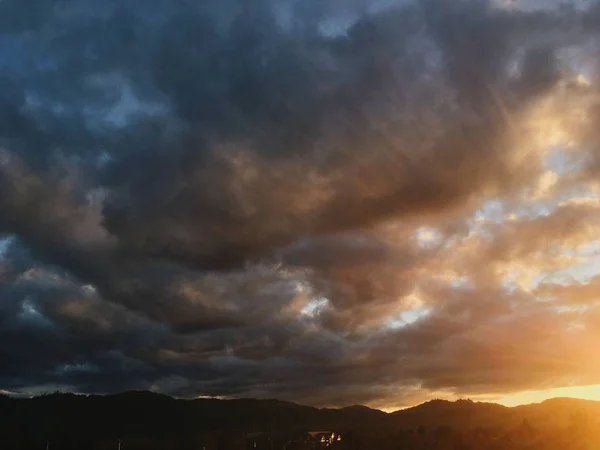 amazing sky with fluffy grey clouds over valley at sunset, Roseburg, Oregon