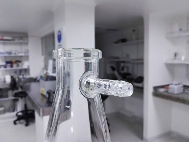 Buchner, vacuum, filter, suction, side-arm flask or Kitasato flask. Thick-walled Erlenmeyer glass flask with a short glass tube and protruding hose barb. Laboratory glassware for scientific and medical research. clipart