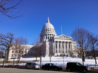 The Wisconsin State Capitol, in Madison, Wisconsin, United States. Governor Office and Supreme Court. Winter and snow view. clipart