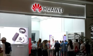Medellin, Colombia - 10/05/2018: Buyers in a store of Asian technology giant Huawei. Many people buying phones and accessories of this brand. clipart