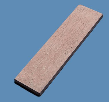 Yerden bir örnek, tek renkli arka planda duvar taşı şekli.