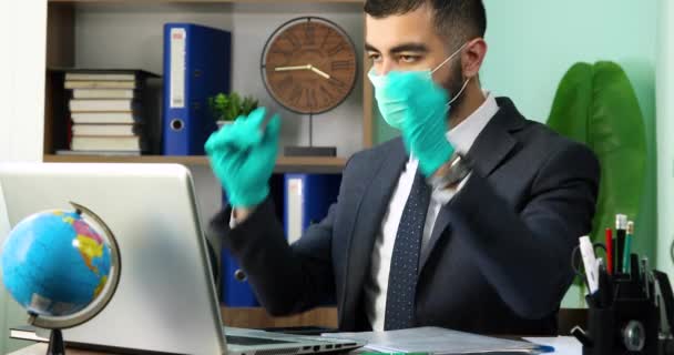 Young Businessman Taking Medical Protective Mask Closing Laptop — Stock Video