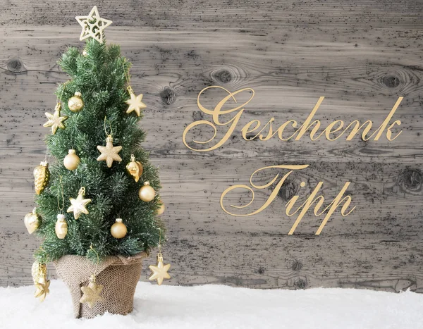 Albero di Natale decorato d'oro, Geschenk Tipp significa punta regalo — Foto Stock