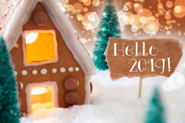 Gingerbread House, bronz Bokeh arka plan, metin Merhaba 2019