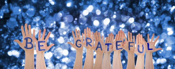 Hands Building Word Be Grateful, Glittering And Sparkling Bokeh Background — Stock Photo, Image