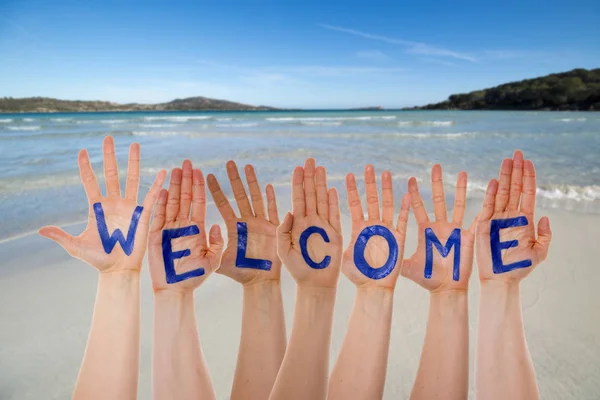 Many Hands Building Word Welcome, Beach And Ocean — Stock Photo, Image