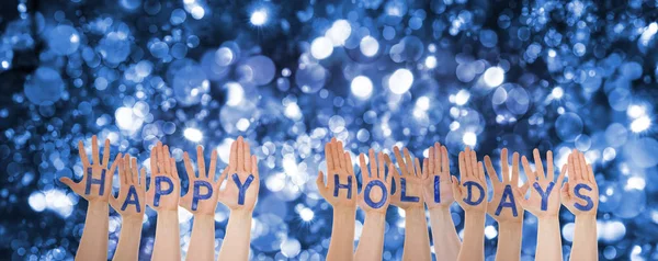 Vele handen gebouw Word Happy Holidays, schitterende Bokeh achtergrond — Stockfoto