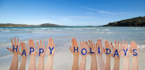 Muchas manos construyendo la palabra Felices Fiestas, Playa y Océano —  Fotos de Stock
