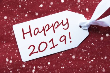 Kırmızı arka plan, kar taneleri, metin mutlu 2019 bir etikette