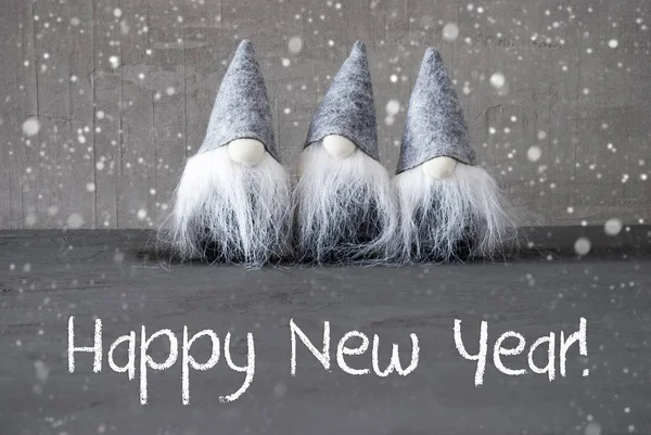 Tre grå tomtar, Cement, snöflingor, gott nytt år — Stockfoto