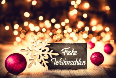 Plaka, hat Frohe Weihnachten mutlu Noeller, mor topları demektir.