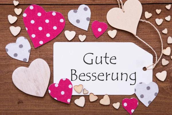 Etykieta, różowe serca, Gute Besserung oznacza Get Well Soon — Zdjęcie stockowe