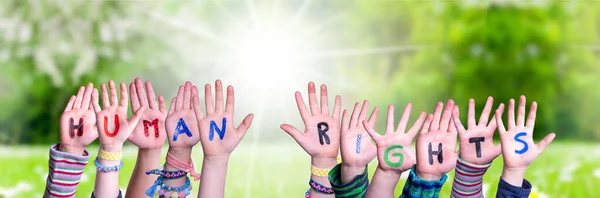 Crianças Mãos Construindo Palavra Direitos Humanos, Grama Prado — Fotografia de Stock