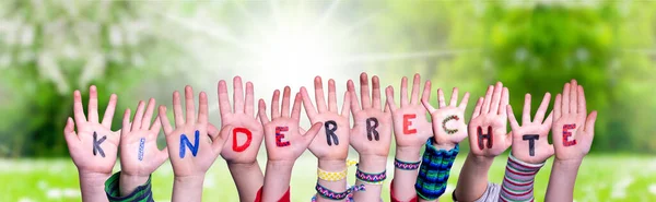 Children Hands Building Word Kinderrecht Means Children Rights, Grass Meadow — Stock Photo, Image