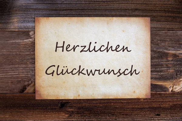 Gamla papper, Glueckwunsch innebär Grattis, Trä bakgrund — Stockfoto