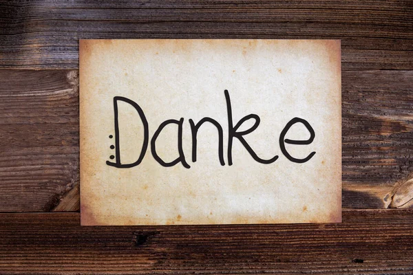 Old Paper, Danke Means Thank You, Wooden Background — Stock Photo, Image